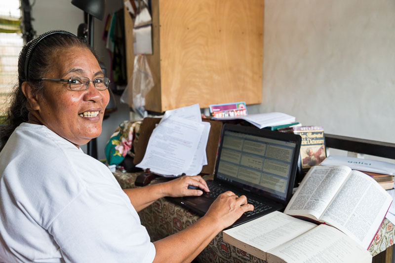 Betty Amon, Nukuoro Bible translator, working at her desk.